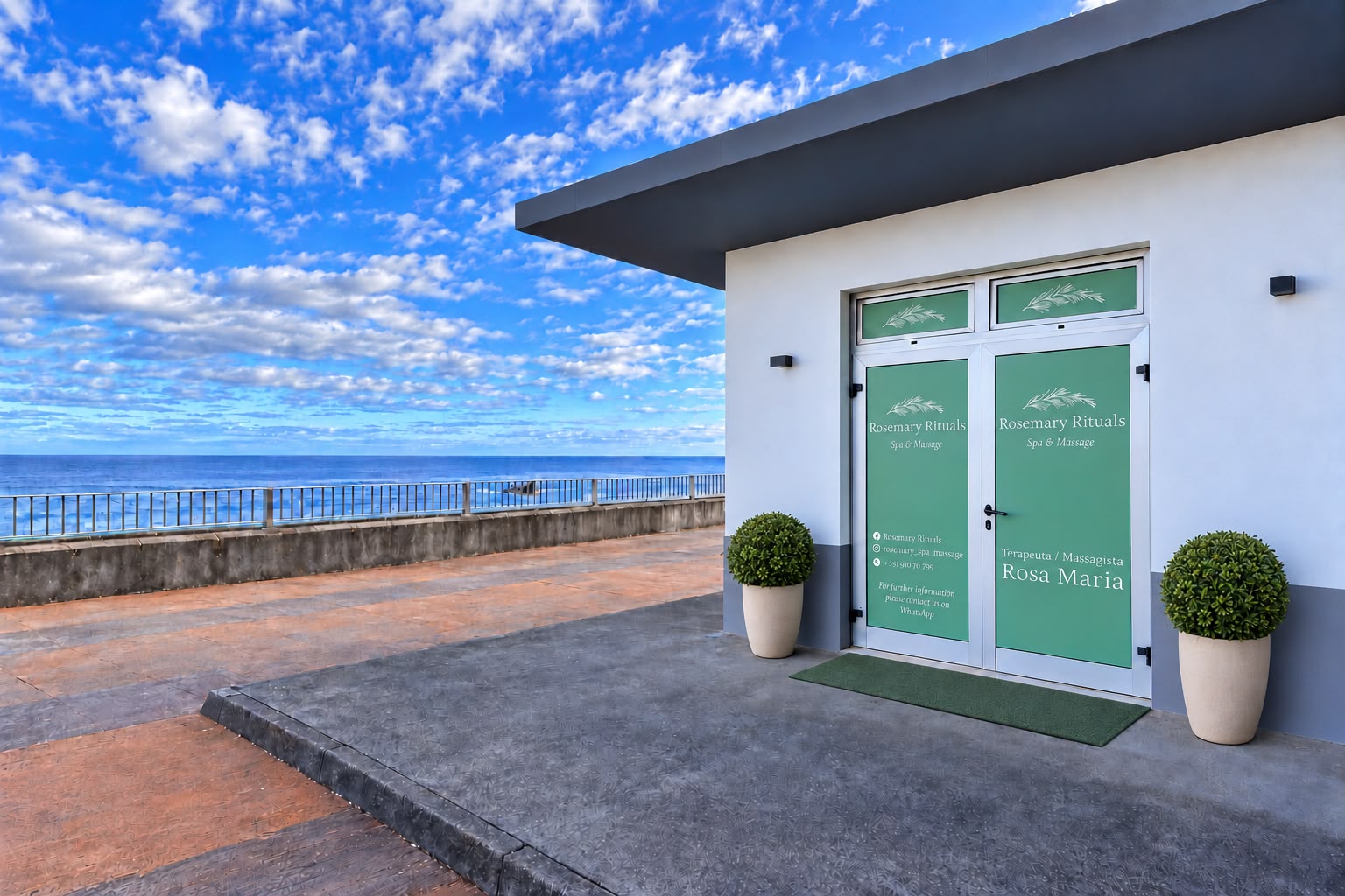 Rosemary Rituals entrance with green doors and an ocean view